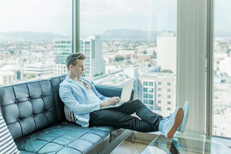 Man working on laptop, implementing affiliate marketing strategies for success