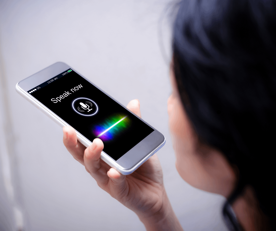 a lady using the voice search feature of the phone